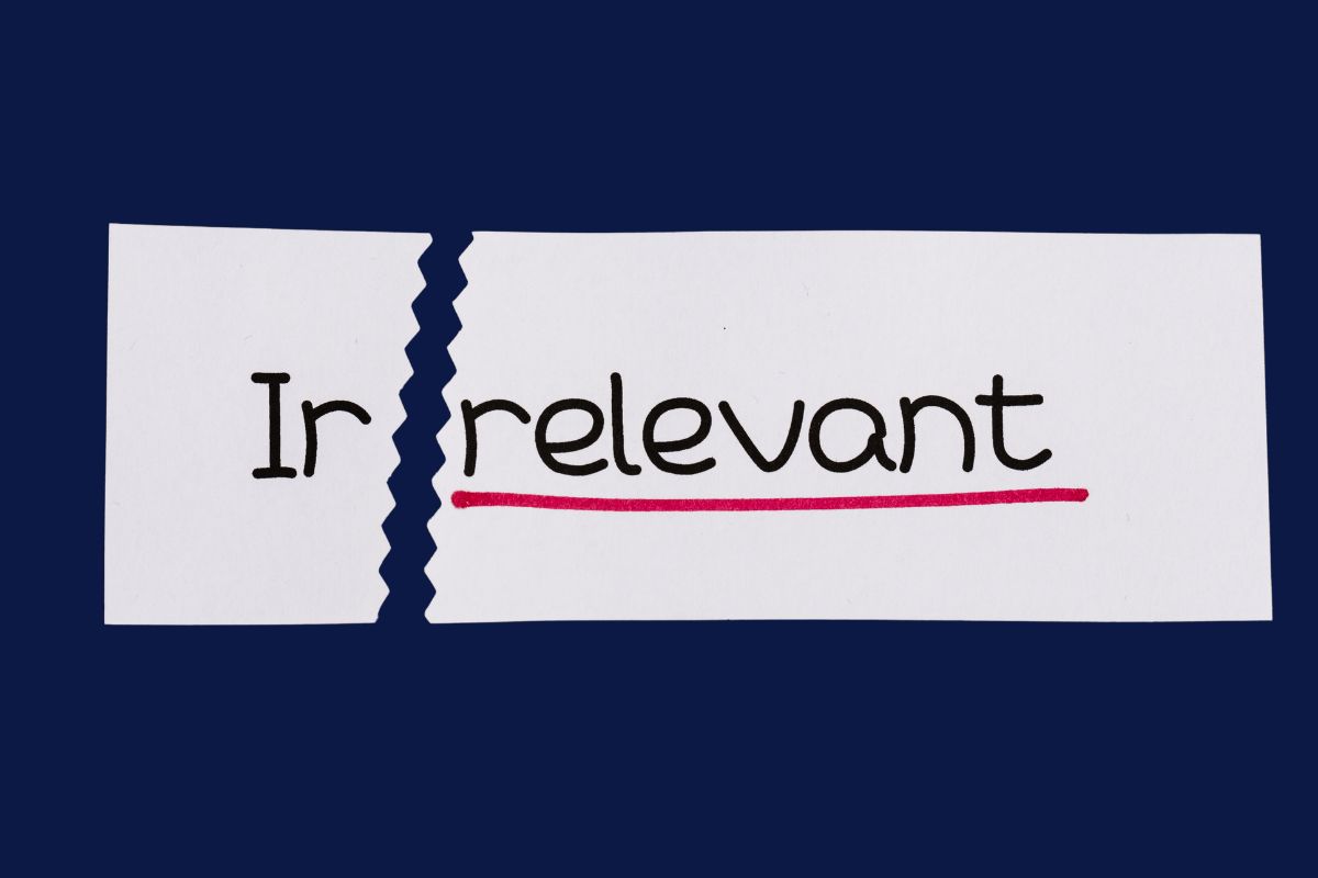 Torn paper showing the word 'Irrelevant' with the 'Ir' crossed out, emphasizing relevance in search engines.